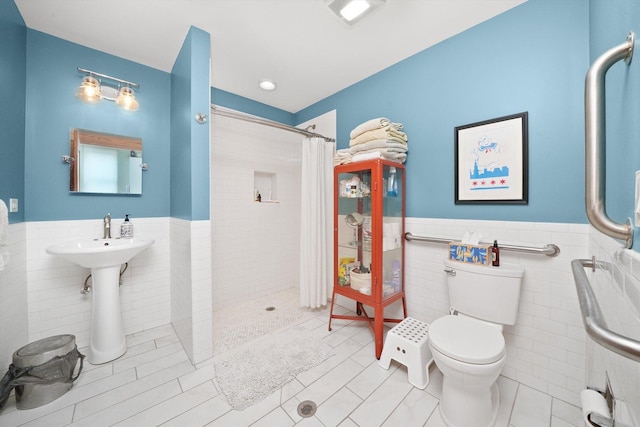 2347 Clarence Ave, Berwyn, IL 60402 - full bathroom with tile walls, tiled shower, wainscoting, and tile patterned flooring