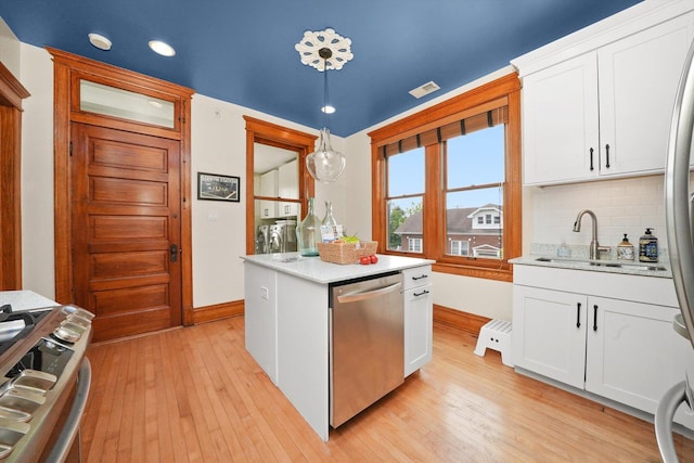 2347 Clarence Ave, Berwyn, IL 60402 - kitchen featuring stainless steel dishwasher, stove, light wood finished floors, decorative backsplash, and recessed lighting