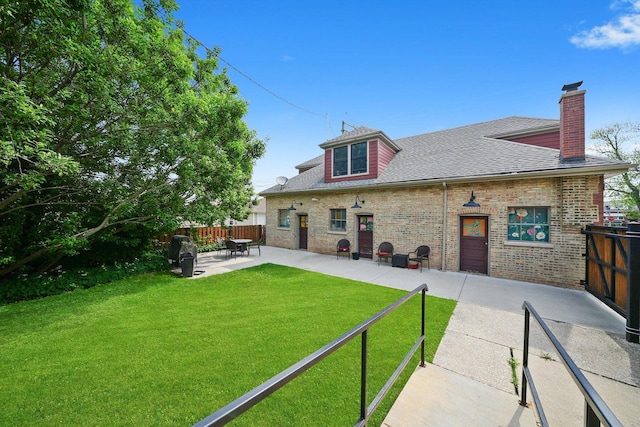 2347 Clarence Ave, Berwyn, IL 60402 - rear view of house with a patio area, roof with shingles, a chimney, and brick siding