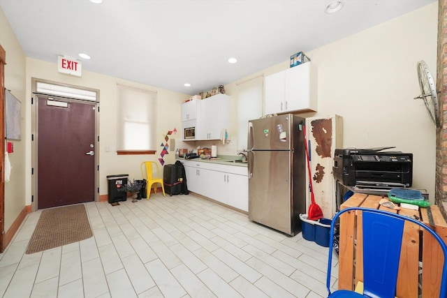 2347 Clarence Ave, Berwyn, IL 60402 - kitchen with stainless steel appliances, white cabinets, recessed lighting, and light countertops