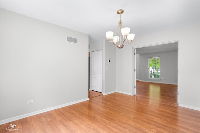 2008 Crosswind Dr, Plainfield, IL 60586 - empty room with a chandelier and light wood-style floors