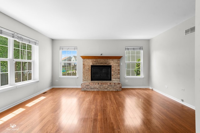 2008 Crosswind Dr, Plainfield, IL 60586 - unfurnished living room featuring hardwood / wood-style floors and a fireplace