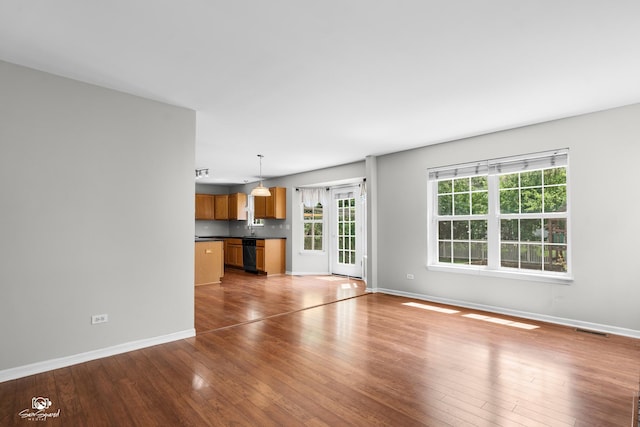 2008 Crosswind Dr, Plainfield, IL 60586 - unfurnished living room with hardwood / wood-style flooring and baseboards