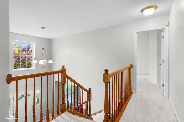 2008 Crosswind Dr, Plainfield, IL 60586 - corridor featuring an upstairs landing, carpet floors, and a chandelier
