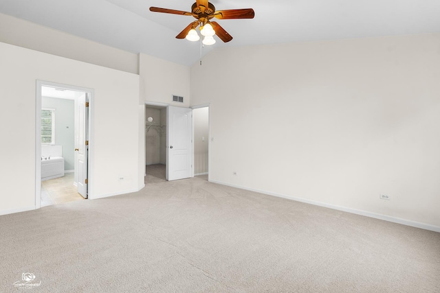 2008 Crosswind Dr, Plainfield, IL 60586 - unfurnished bedroom featuring light carpet, a spacious closet, high vaulted ceiling, connected bathroom, and a closet