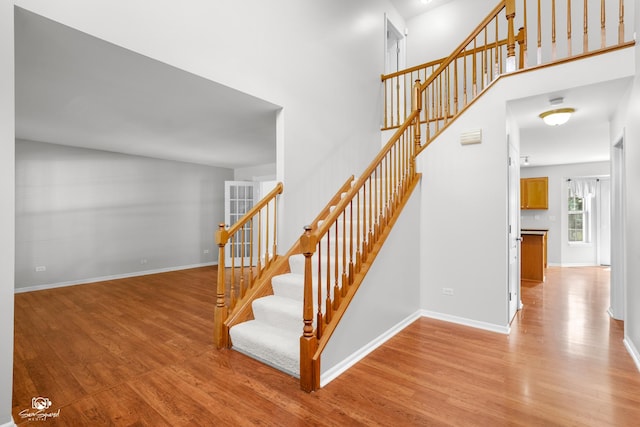 2008 Crosswind Dr, Plainfield, IL 60586 - staircase with wood finished floors and a towering ceiling
