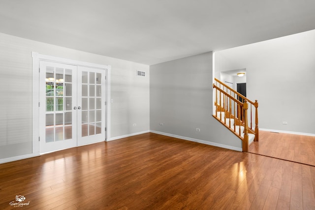 2008 Crosswind Dr, Plainfield, IL 60586 - empty room featuring wood finished floors, french doors, and stairway