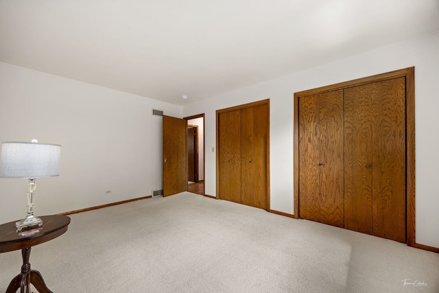 1447 Hillcrest Rd, Downers Grove, IL 60516 - unfurnished bedroom featuring carpet flooring and multiple closets