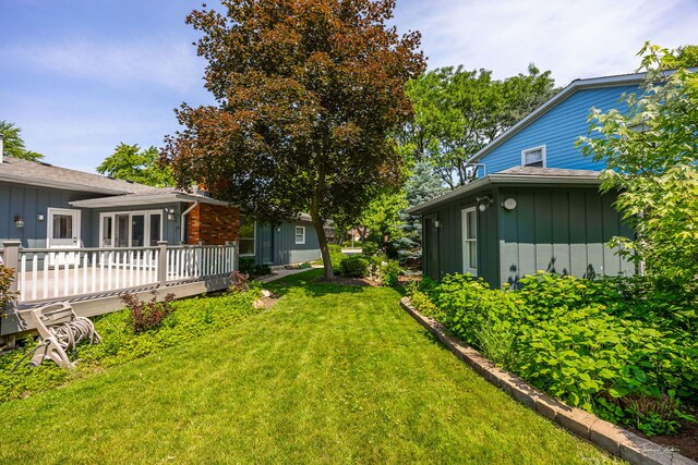 1447 Hillcrest Rd, Downers Grove, IL 60516 - view of grassy yard featuring a deck