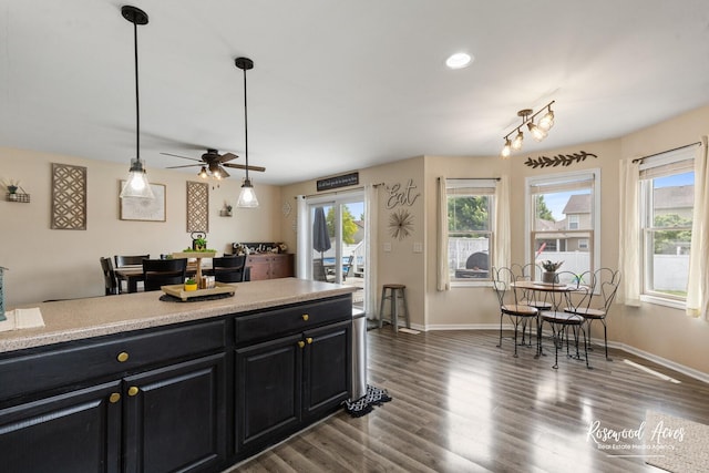 840 Peony Ln, Bourbonnais, IL 60914 - kitchen with dark cabinets, ceiling fan, dark wood-style flooring, light countertops, and recessed lighting