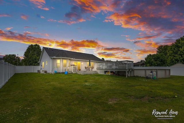 840 Peony Ln, Bourbonnais, IL 60914 - rear view of house featuring a wooden deck, a fenced backyard, and a pool