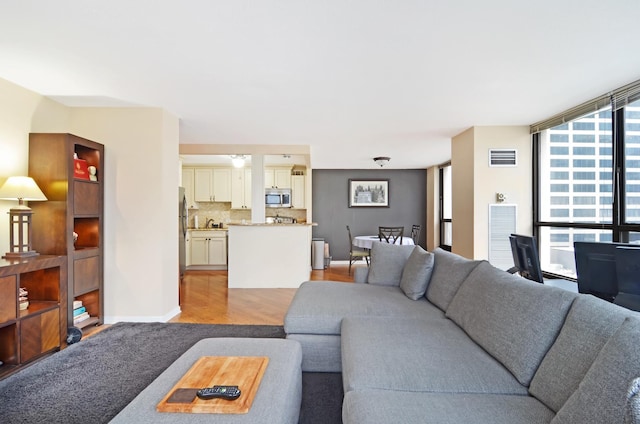 405 N Wabash Ave Unit 2211, Chicago, IL 60611 - living room featuring healthy amount of natural light and light wood-style floors