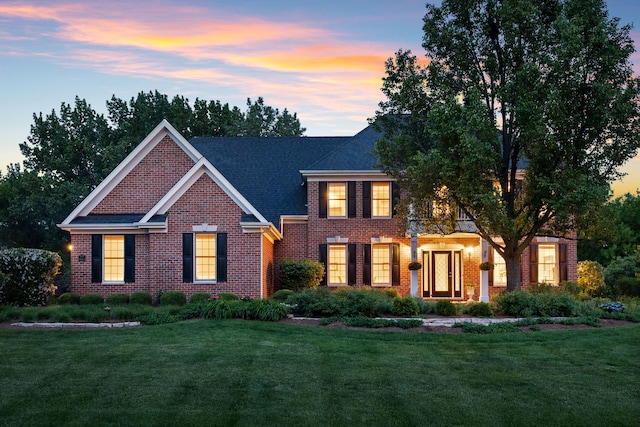 38W385 Stevens Glen Rd, Saint Charles, IL 60175 - colonial-style house featuring brick siding, a yard, and roof with shingles