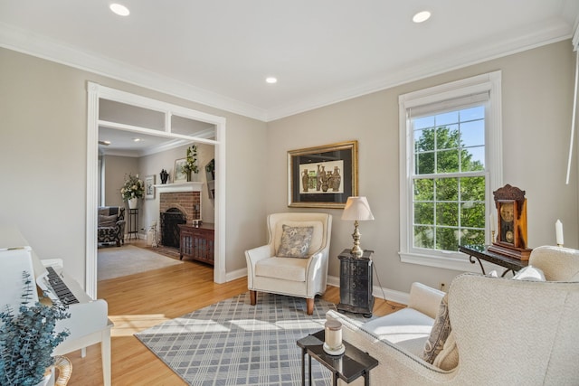 38W385 Stevens Glen Rd, Saint Charles, IL 60175 - living area featuring plenty of natural light, crown molding, wood finished floors, a brick fireplace, and recessed lighting
