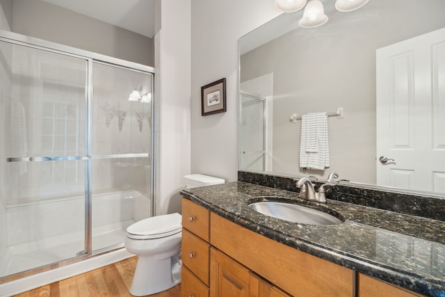 38W385 Stevens Glen Rd, Saint Charles, IL 60175 - bathroom with vanity, a stall shower, and wood finished floors