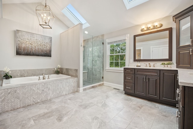 38W385 Stevens Glen Rd, Saint Charles, IL 60175 - bathroom featuring a skylight, vanity, a garden tub, a stall shower, and a chandelier