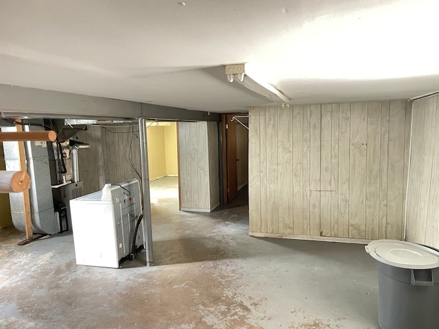 3909 W 71st St, Chicago, IL 60629 - unfinished below grade area featuring wood walls, heating unit, and washer / dryer