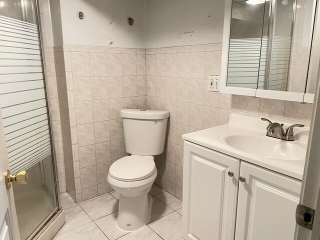 3909 W 71st St, Chicago, IL 60629 - full bathroom featuring vanity, a shower stall, and tile walls