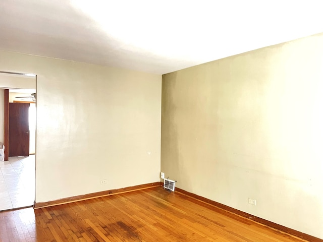 3909 W 71st St, Chicago, IL 60629 - unfurnished room with light wood-style floors and baseboards
