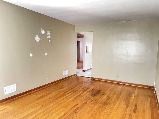 3909 W 71st St, Chicago, IL 60629 - empty room with light wood finished floors and baseboards