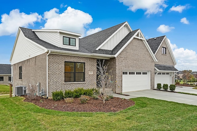 12830 Marble St Unit 25A, Lemont, IL 60439 - view of front of home with driveway, brick siding, a front lawn, and board and batten siding