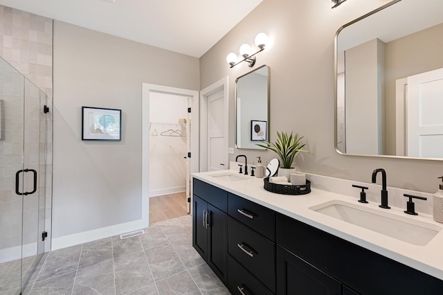 12830 Marble St Unit 25A, Lemont, IL 60439 - bathroom featuring double vanity, a stall shower, and a walk in closet
