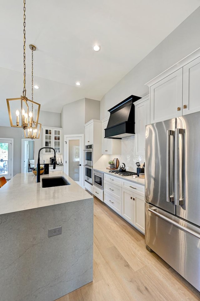12830 Marble St Unit 25A, Lemont, IL 60439 - kitchen featuring stainless steel appliances, premium range hood, light wood-style floors, white cabinetry, and recessed lighting
