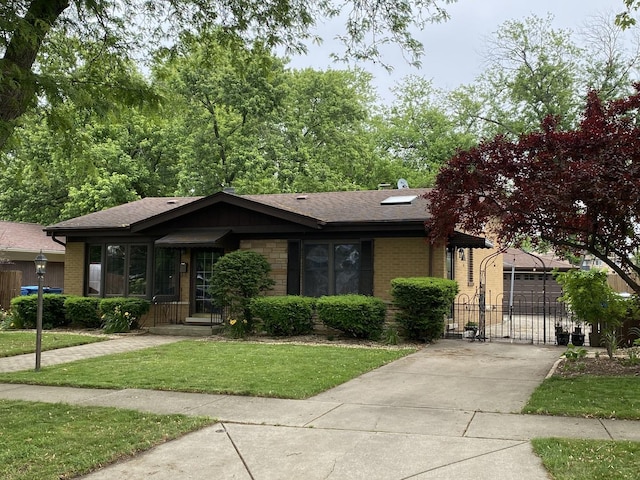 11737 S Kedvale Ave, Alsip, IL 60803 - view of front facade with brick siding, a gate, a front yard, and roof with shingles