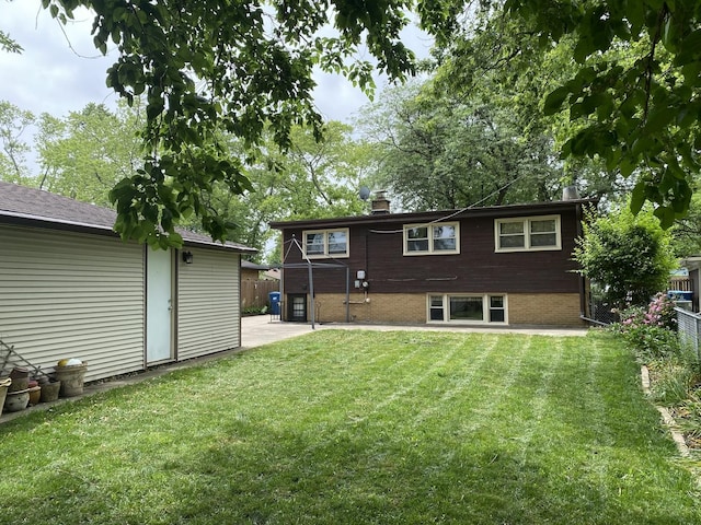 11737 S Kedvale Ave, Alsip, IL 60803 - back of property with a chimney, brick siding, and a patio area
