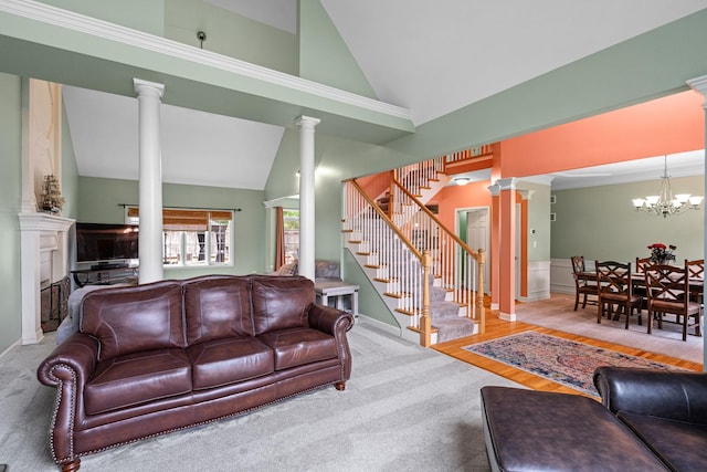 11646 Liberty Ln, Plainfield, IL 60585 - living room with decorative columns, lofted ceiling, stairway, a fireplace, and a chandelier