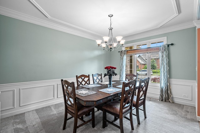 11646 Liberty Ln, Plainfield, IL 60585 - dining room featuring a chandelier, carpet, crown molding, a wainscoted wall, and a decorative wall