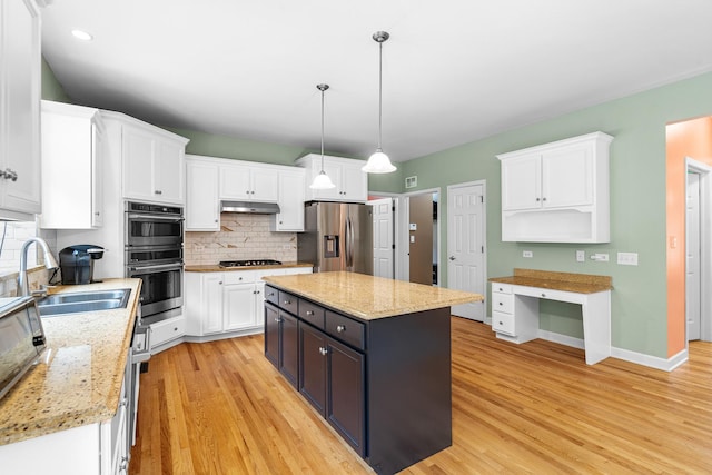 11646 Liberty Ln, Plainfield, IL 60585 - kitchen with appliances with stainless steel finishes, white cabinets, decorative backsplash, under cabinet range hood, and light wood finished floors