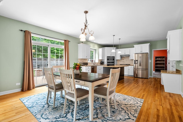 11646 Liberty Ln, Plainfield, IL 60585 - dining space with baseboards and light wood-style floors