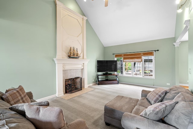 11646 Liberty Ln, Plainfield, IL 60585 - carpeted living area with high vaulted ceiling, a tiled fireplace, a ceiling fan, and ornate columns
