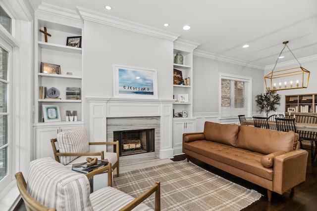 2769 N Kenmore Ave Unit 1, Chicago, IL 60614 - living area featuring built in features, recessed lighting, a premium fireplace, a chandelier, and wood finished floors