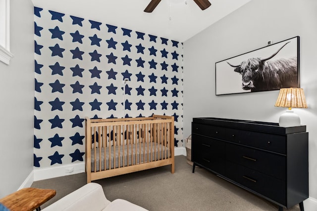 2769 N Kenmore Ave Unit 1, Chicago, IL 60614 - carpeted bedroom featuring wallpapered walls, a nursery area, ceiling fan, and an accent wall