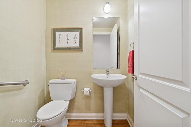2835 N Lakewood Ave Unit 2C, Chicago, IL 60657 - half bath featuring toilet and wood finished floors