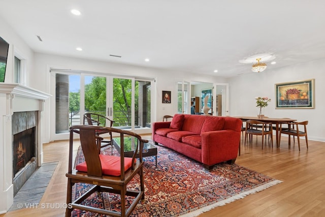 2835 N Lakewood Ave Unit 2C, Chicago, IL 60657 - living room featuring a high end fireplace, recessed lighting, light wood-type flooring, and french doors