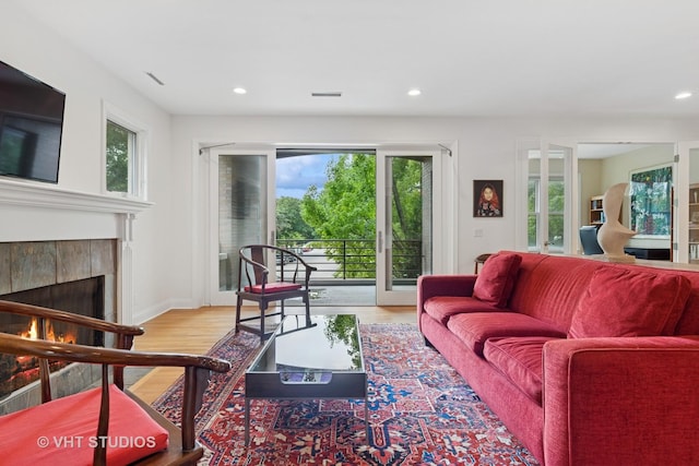 2835 N Lakewood Ave Unit 2C, Chicago, IL 60657 - living room with wood finished floors, recessed lighting, and a tile fireplace