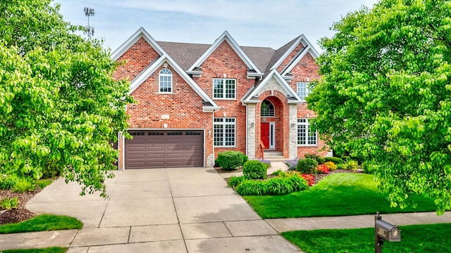 5327 Bamboo Ln, Naperville, IL 60564 - traditional-style home featuring a garage, brick siding, a front lawn, and driveway