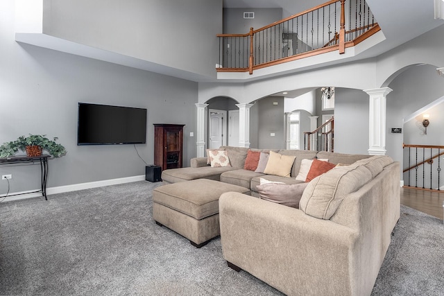 5327 Bamboo Ln, Naperville, IL 60564 - living room with ornate columns, arched walkways, a high ceiling, carpet, and stairs