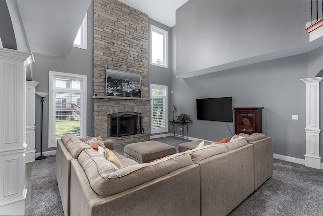 5327 Bamboo Ln, Naperville, IL 60564 - living area featuring a fireplace, a towering ceiling, carpet, and ornate columns