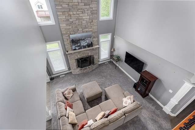 5327 Bamboo Ln, Naperville, IL 60564 - carpeted living area featuring a stone fireplace and a high ceiling