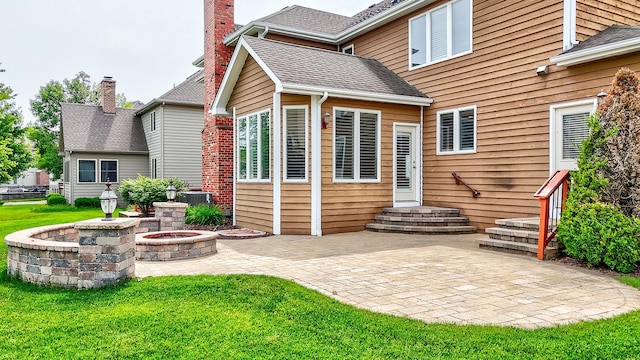 5327 Bamboo Ln, Naperville, IL 60564 - rear view of house with a patio, a lawn, a chimney, and a shingled roof