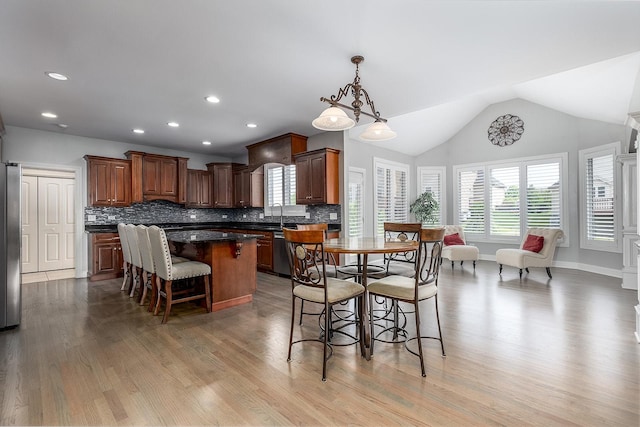 5327 Bamboo Ln, Naperville, IL 60564 - dining space featuring light wood finished floors, vaulted ceiling, and recessed lighting