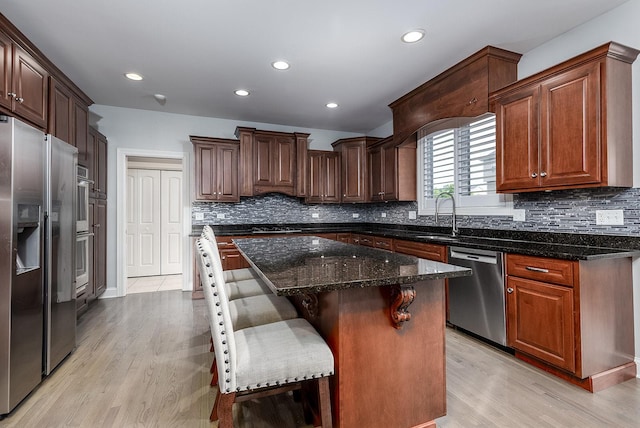 5327 Bamboo Ln, Naperville, IL 60564 - kitchen featuring appliances with stainless steel finishes, light wood-type flooring, decorative backsplash, and recessed lighting