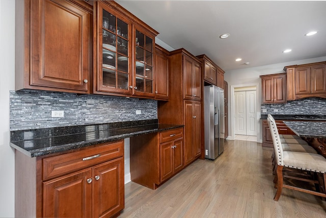 5327 Bamboo Ln, Naperville, IL 60564 - kitchen featuring stainless steel refrigerator with ice dispenser, light wood finished floors, recessed lighting, glass insert cabinets, and tasteful backsplash
