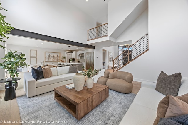 20 Pinnacle Ct, Naperville, IL 60565 - living room with light wood-type flooring, stairway, a high ceiling, and recessed lighting