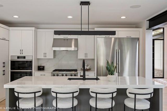 20 Pinnacle Ct, Naperville, IL 60565 - kitchen with ventilation hood, stainless steel refrigerator, double oven, white cabinets, and recessed lighting