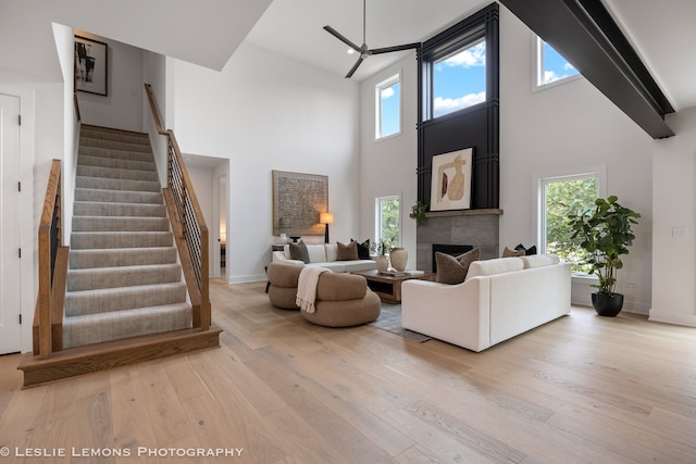20 Pinnacle Ct, Naperville, IL 60565 - living area with a towering ceiling, wood finished floors, stairway, and a fireplace